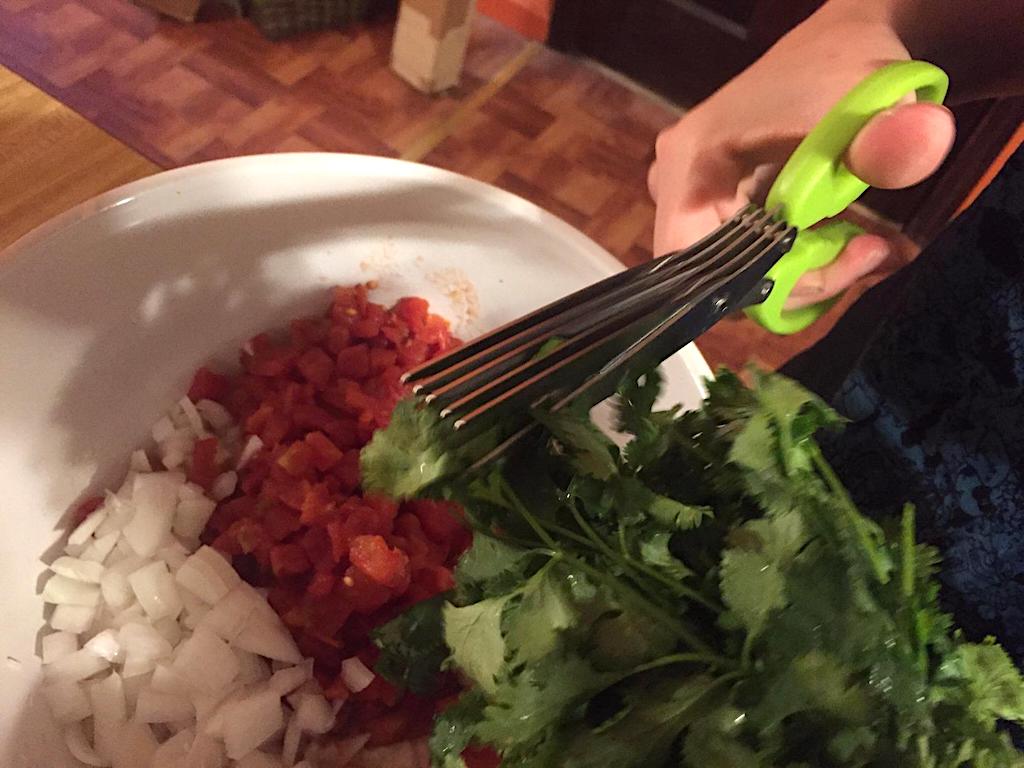 using Herb Scissors with cilantro in bowl