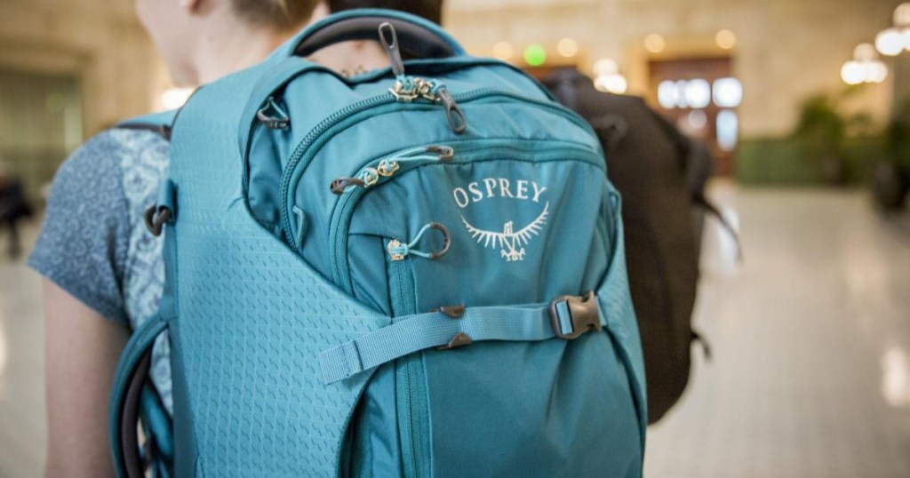 woman wearing Osprey Porter 30 Travel Pack