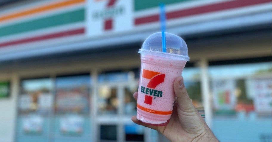 man holding 7 Eleven Slurpee