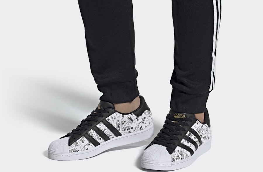 man wearing Adidas Superstar Shoes