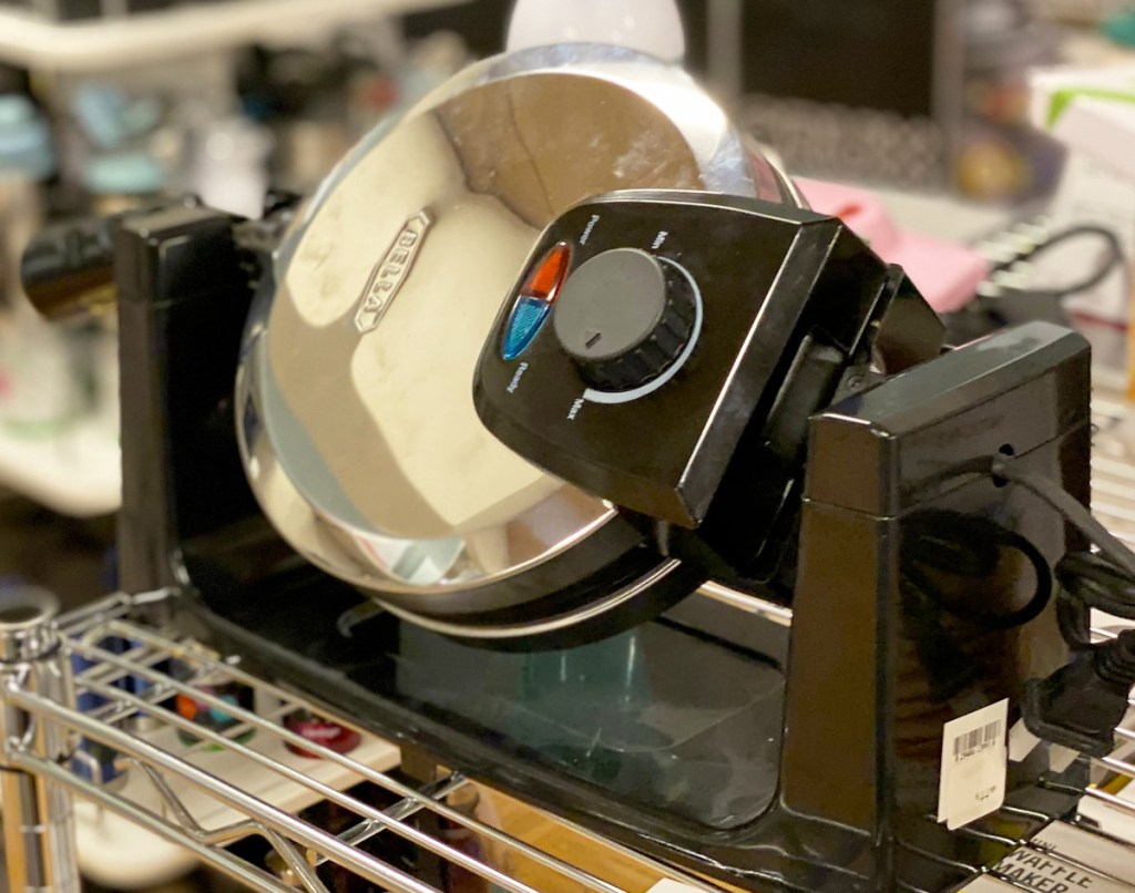 stainless steel rotating waffle maker on display at store