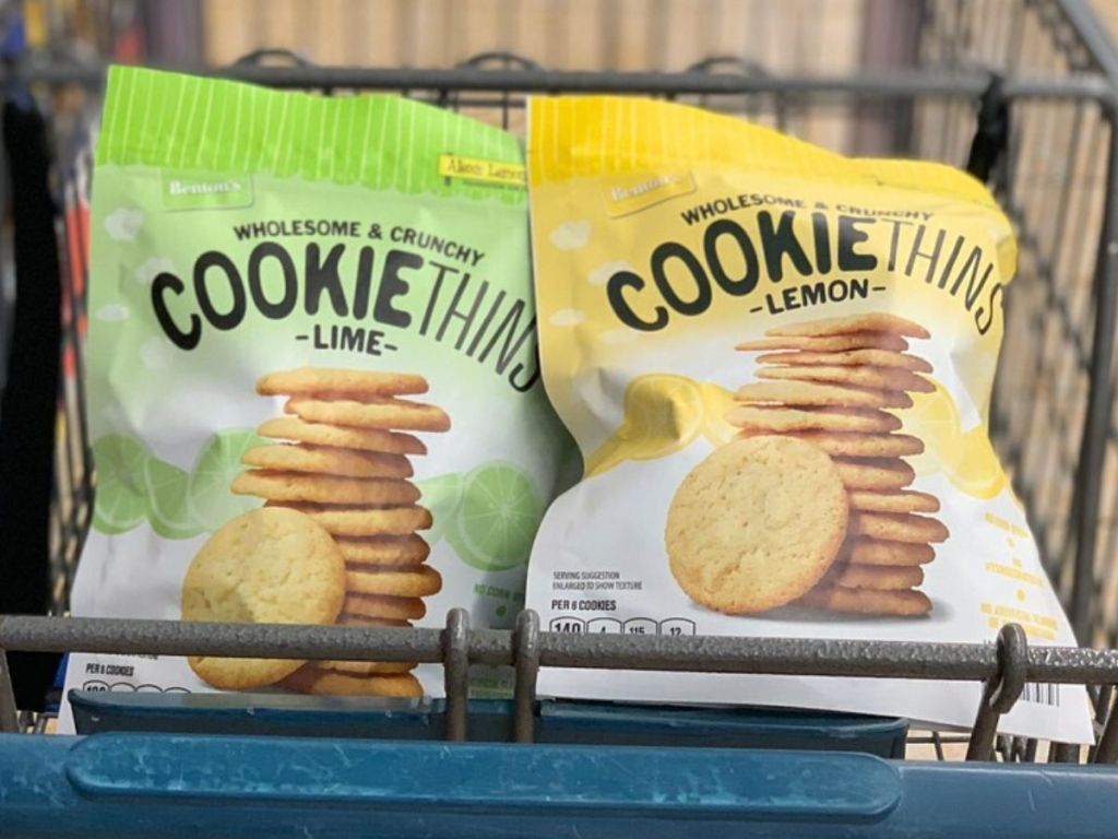 two bags of cookie thins in the front of a shopping cart