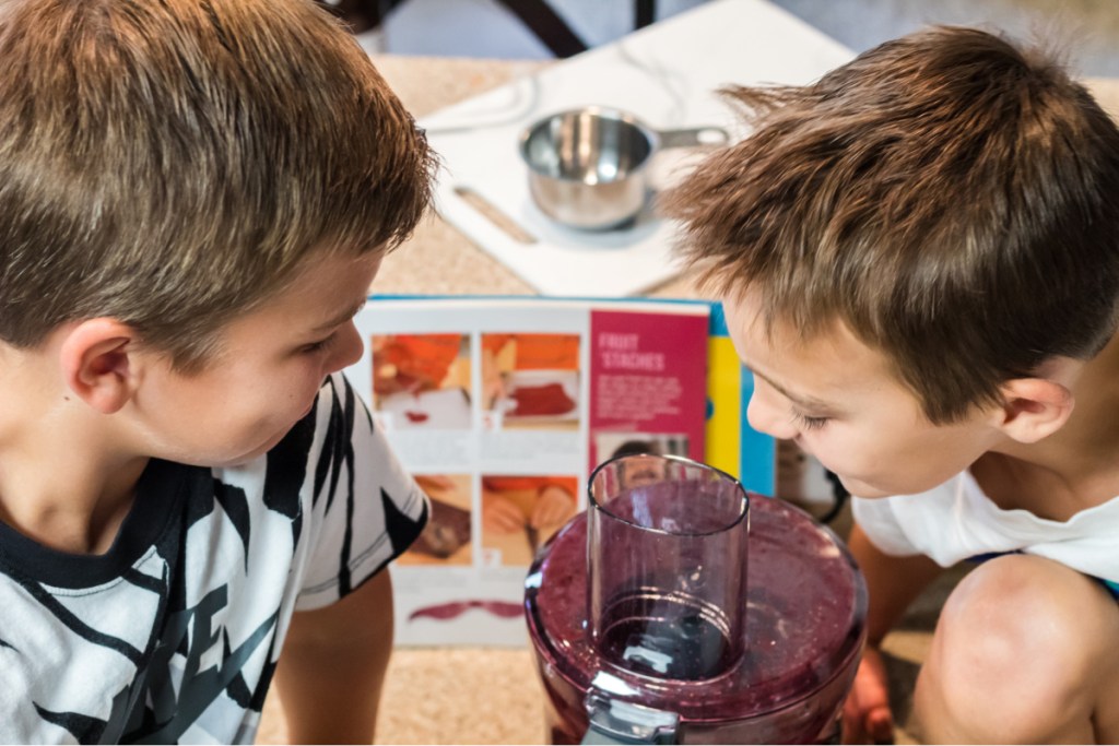 boys looking at a food processor