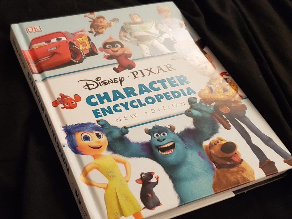 brightly colored book with Disney characters on the front