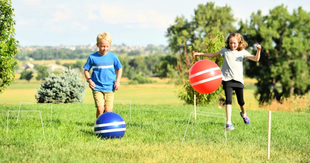 kids playing with a Giant Games Giant Kick Croquet