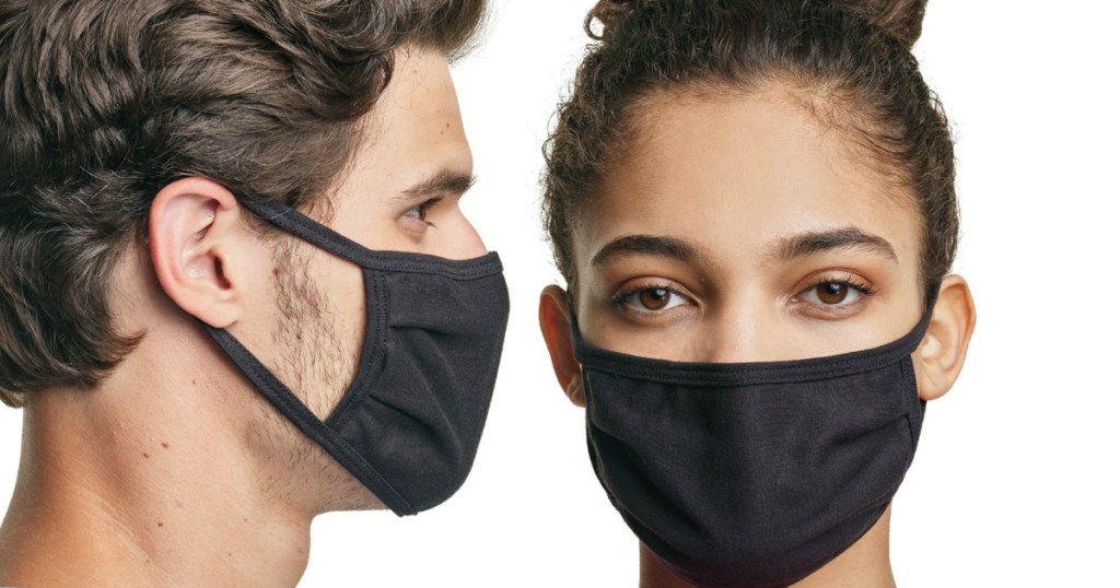 man and woman wearing black face masks