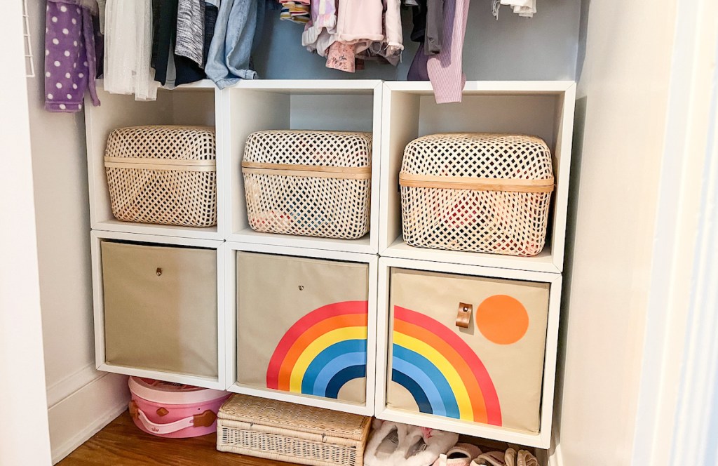 close up of ikea storage containers and baskets in white organizers on wall