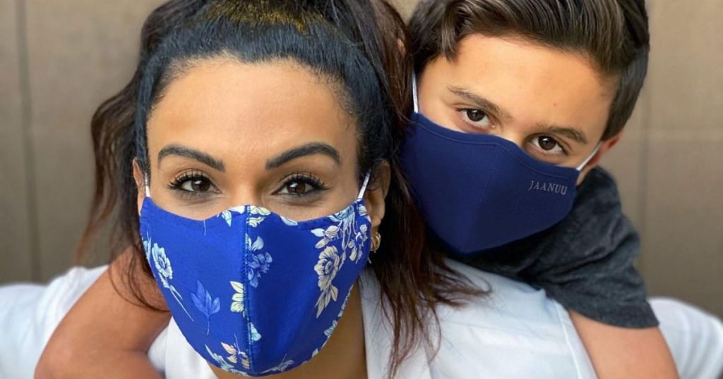 woman and little boy wearing face masks with little boy on woman's back