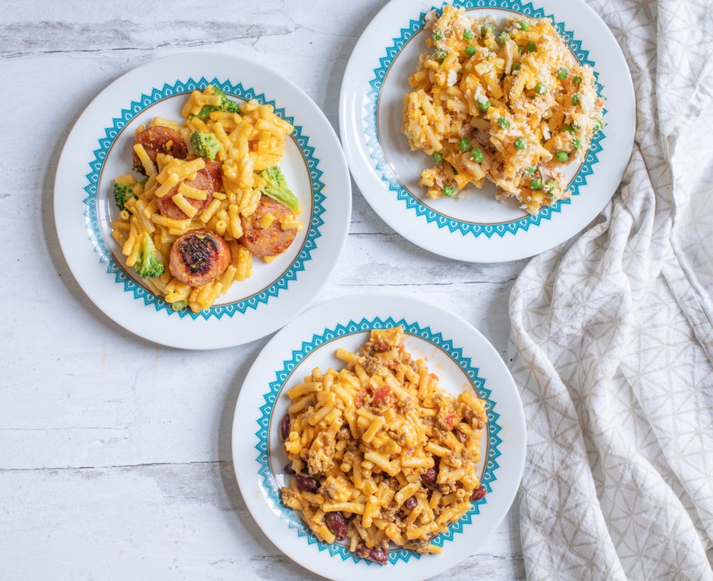 3 plates of mac and cheese with different toppings