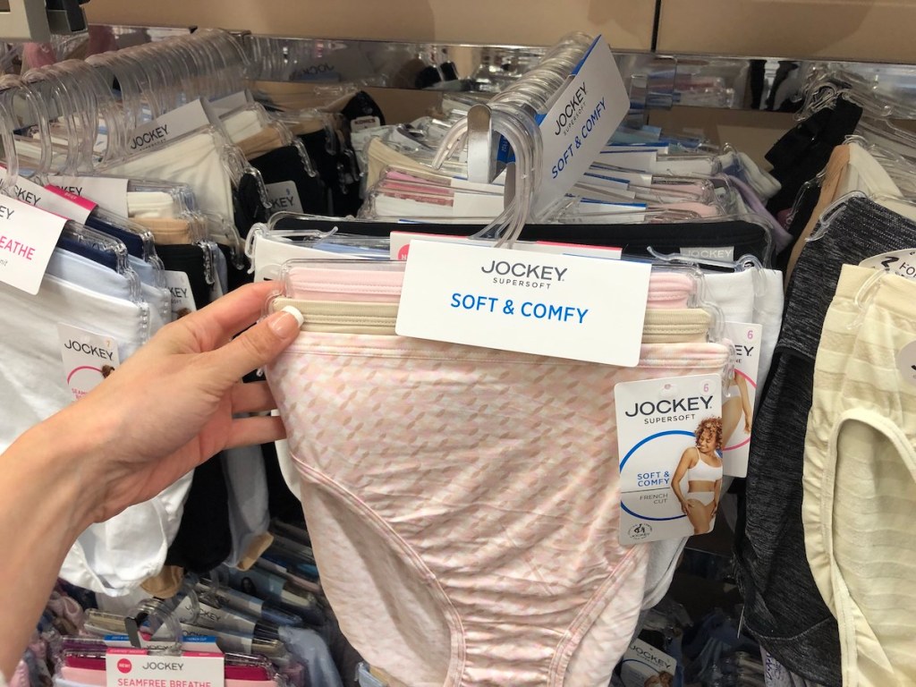 woman hand holding pack of jockey underwear in store