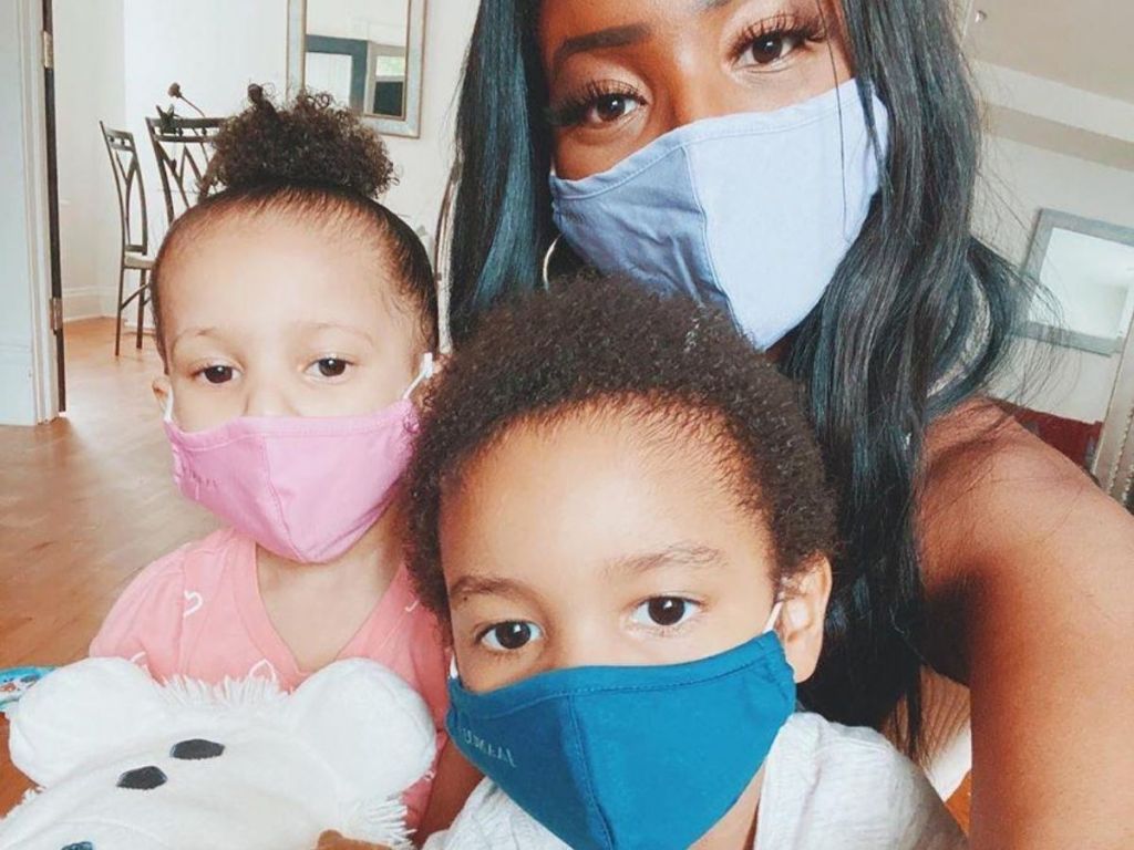 mom and two kids wearing face masks