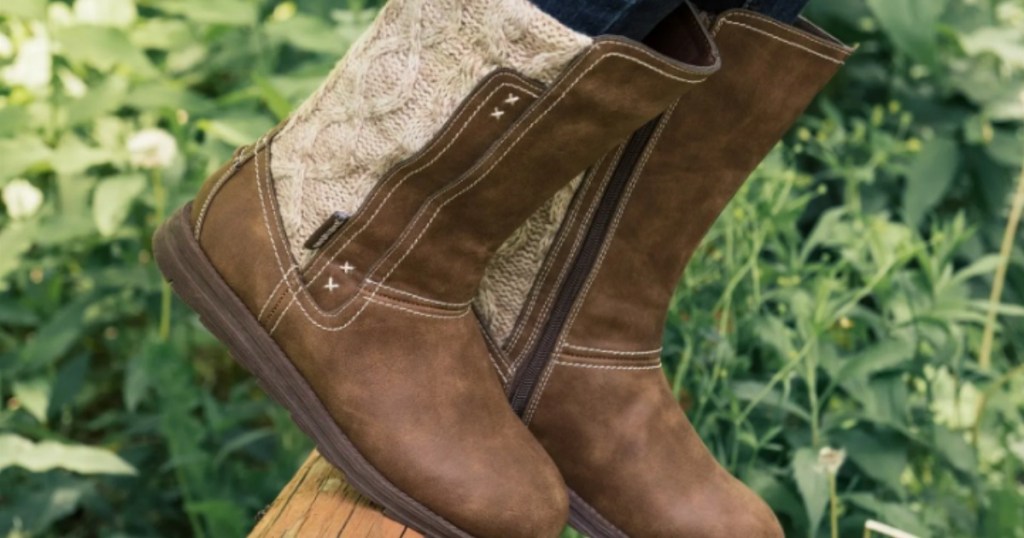 Women on fence wearing Muk Luks Stacy Boots