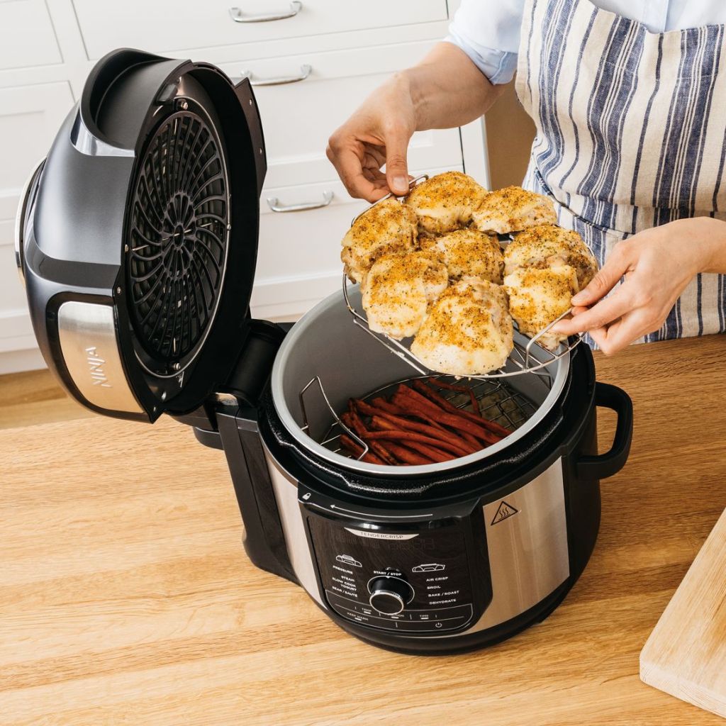 Woman cooking biscuits with Ninja Foodi Fryer