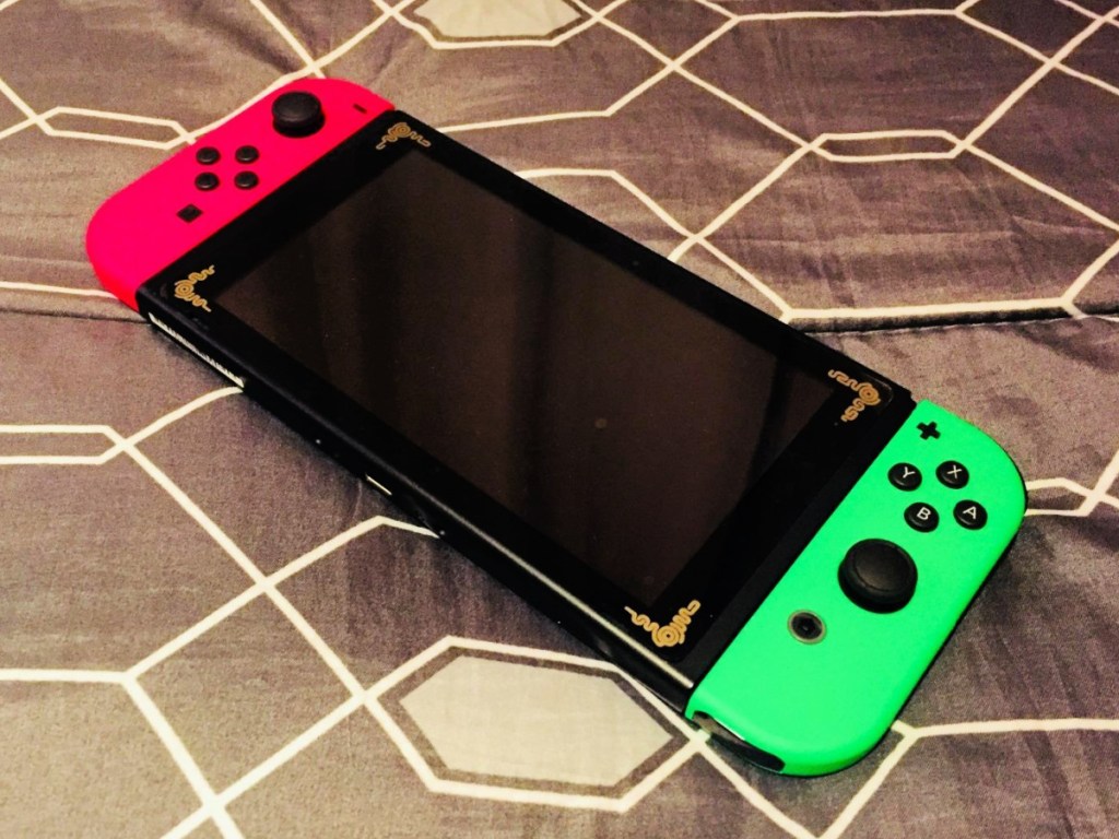 Nintendo Switch with Joy-Cons in Neon Pink and Green