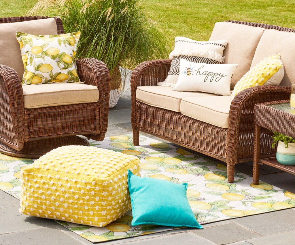 wicker outdoor patio set on a lemon print outdoor rug