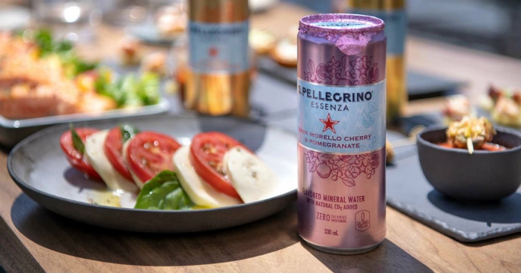 San Pellegrino Essenza Cherry can next to salad