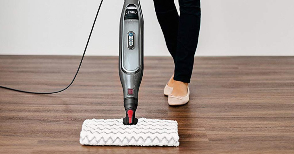 woman pushing shark genius steam mop on hardwood floors