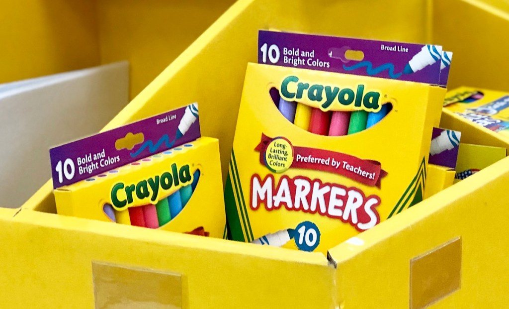 yellow store display with yellow boxes of crayola bold markers