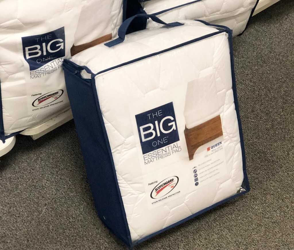 the big one mattress pad sitting on floor near shelf of mattress pads