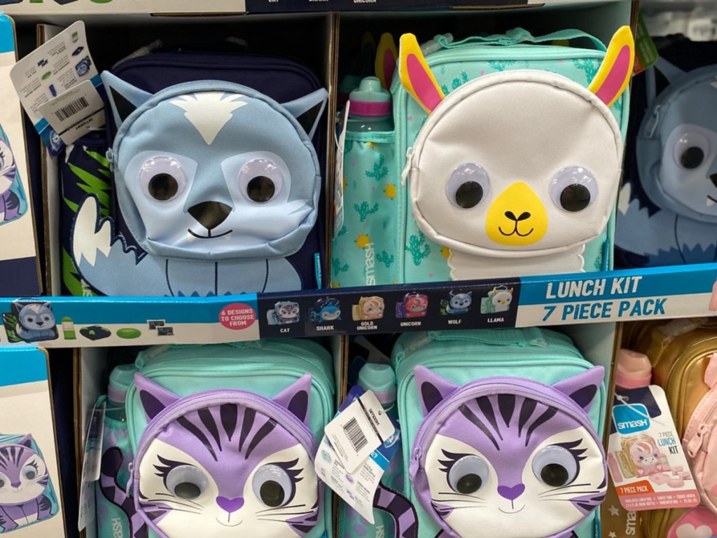 store display with lunch boxes that have animals on it