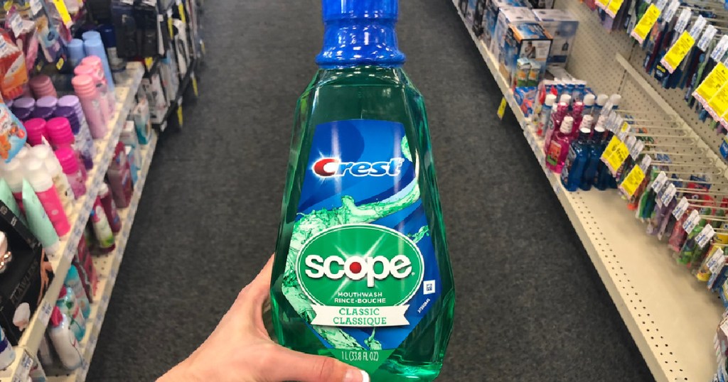 hand holding bottle of scope