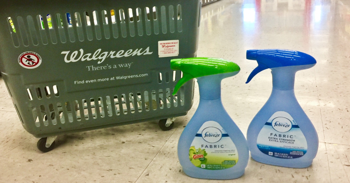 two bottles of Air freshener at walgreens on the floor in front of a walgreens basket