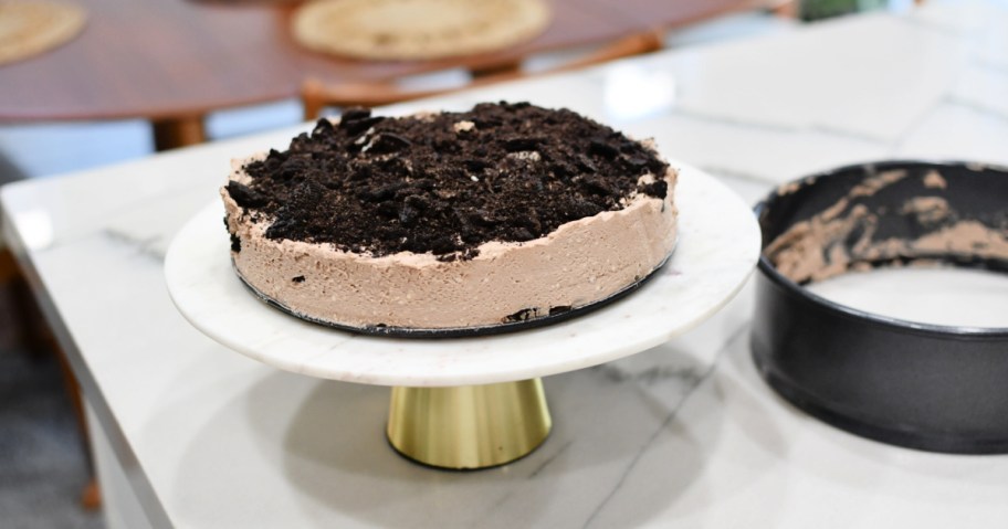 finished oreo cake on a cake stand