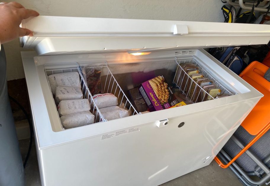 open deep freezer with food inside