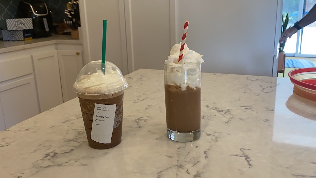 frappuccino drinks with whipped cream on kitchen counter 