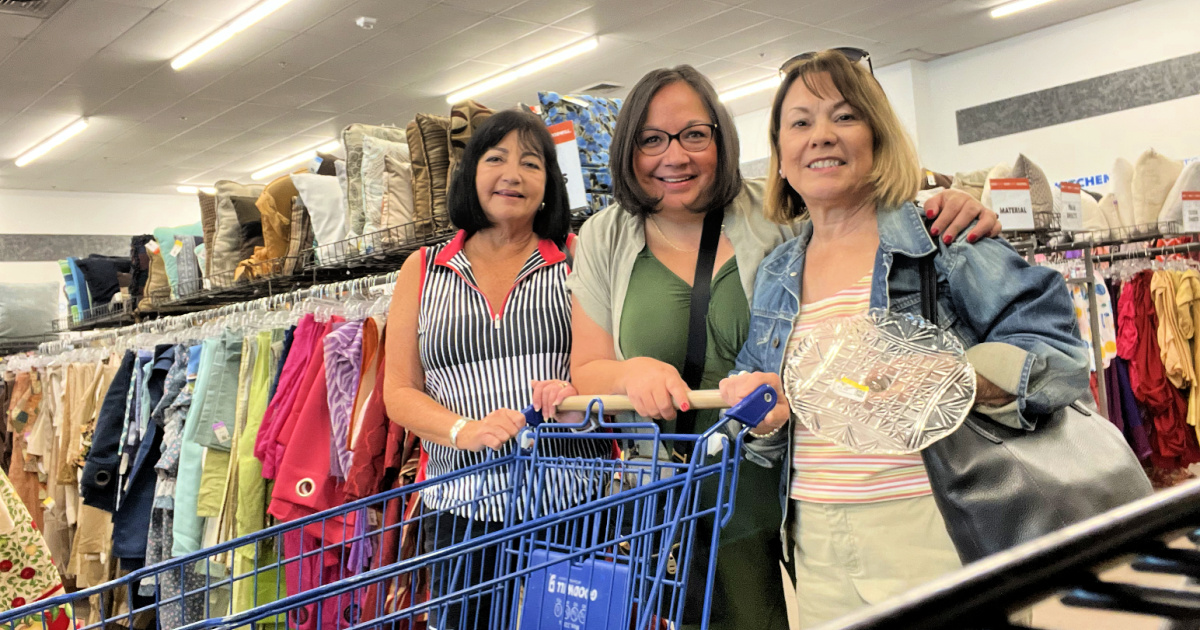 three women getting a senior discount at a goodwill or savers near me