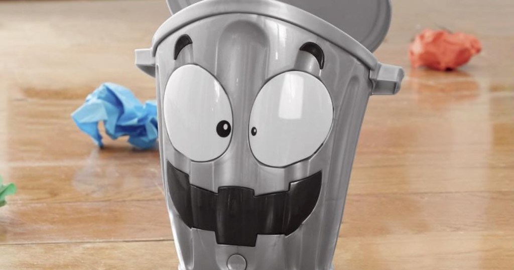 silver small trashcan with face painted on it