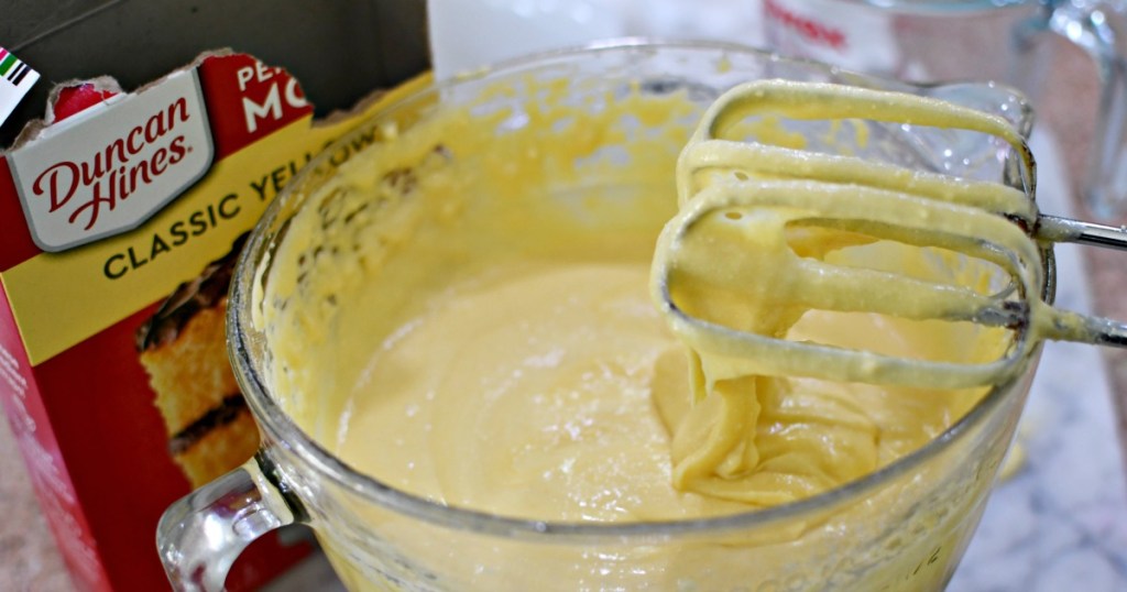 mixing up cake mix from boxed cake to taste like a bakery style cake