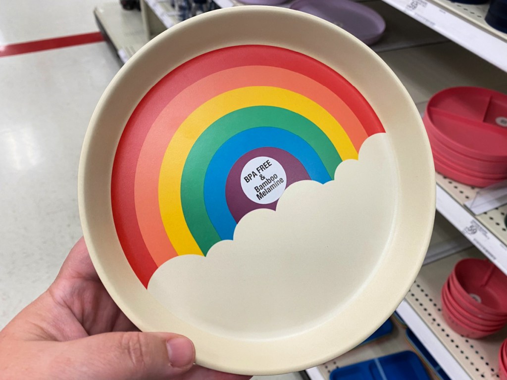 person holding Pillowfort 7.3" Bamboo and Melamine Kids Dinner Plate with rainbow