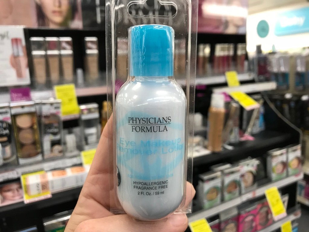 hand holding bottle of physicians formula makeup remover in cvs