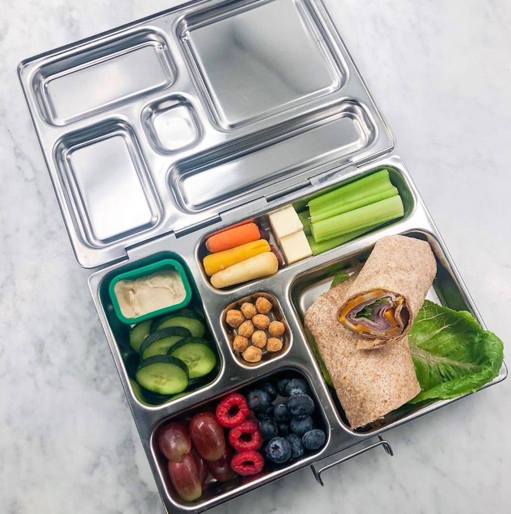 Planetbox lunch container filled with snacks, fruits, and veggies 