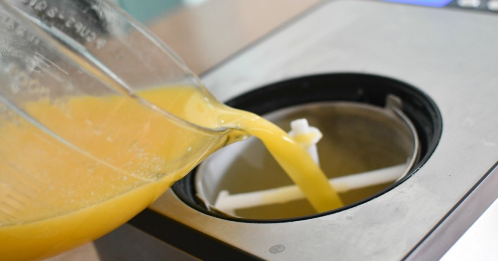 pouring dole whip pineapple mix into ice cream maker