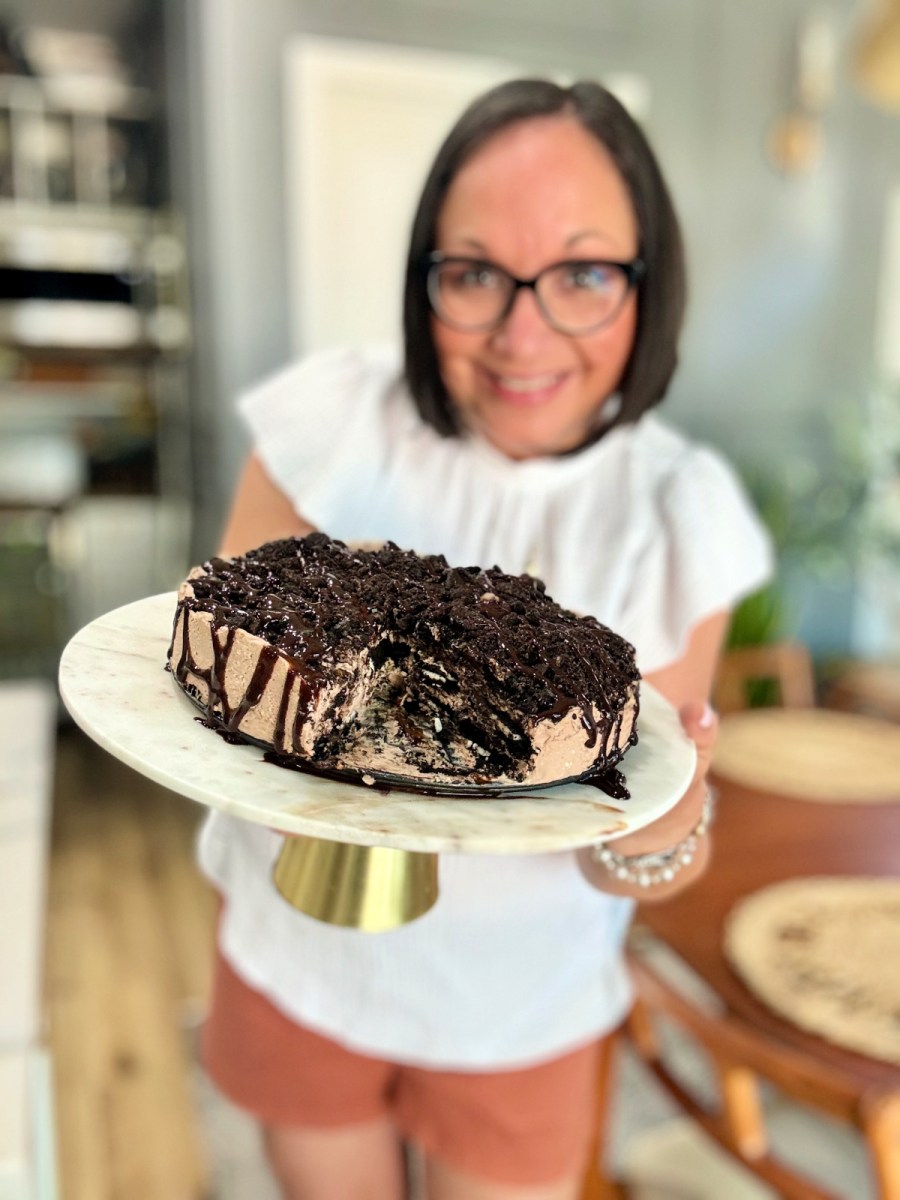 woman holding an Oreo Icebox cake