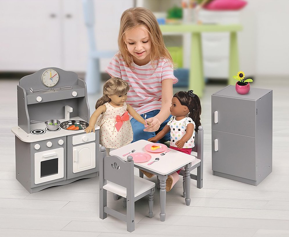 girl playing with doll in Badger Basket Kitchen