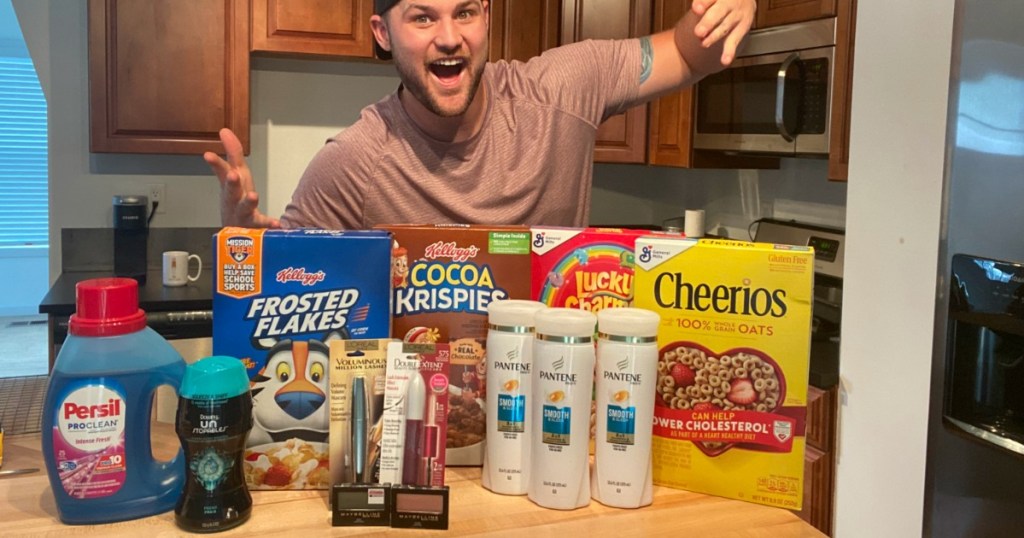 man standing next to grocery purchase