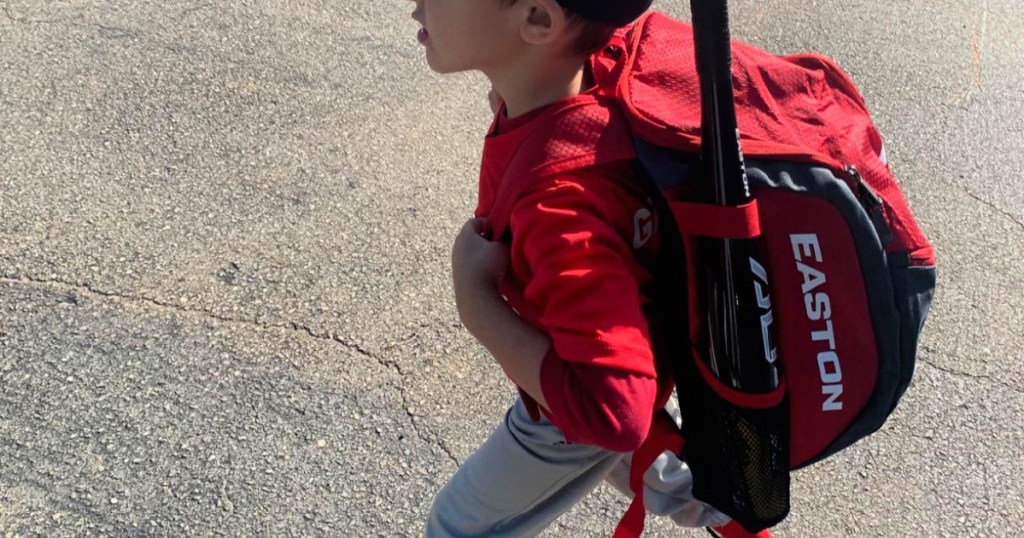 boy wearing red easton backpack