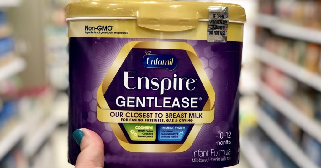 hand holding enfamil Gentlease infant formula