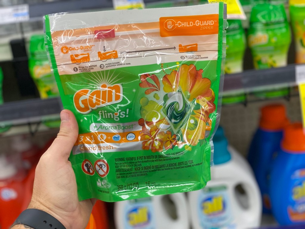 hand holding bag of Gain Flings 16 Count in cvs