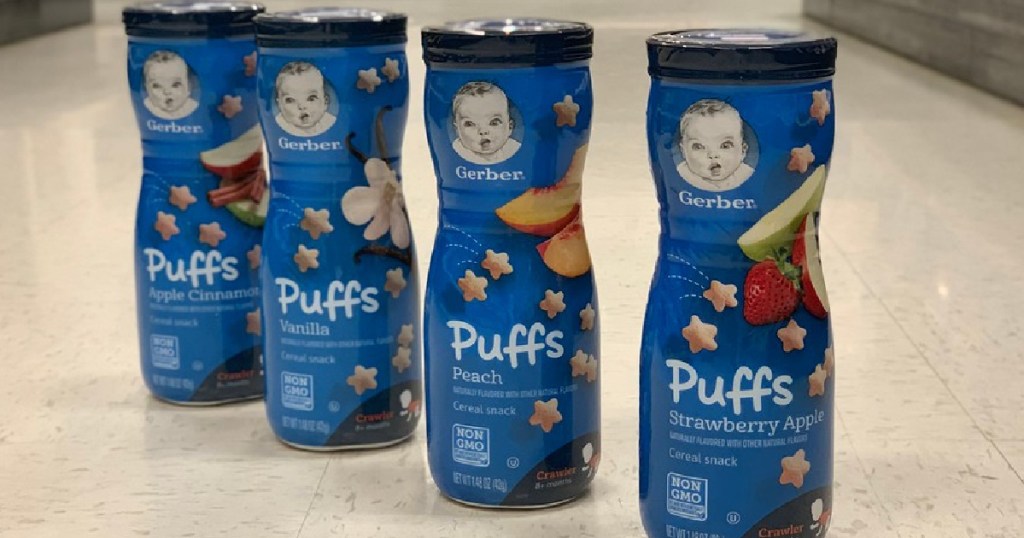 four containers of kids puff cereal snacks on store floor