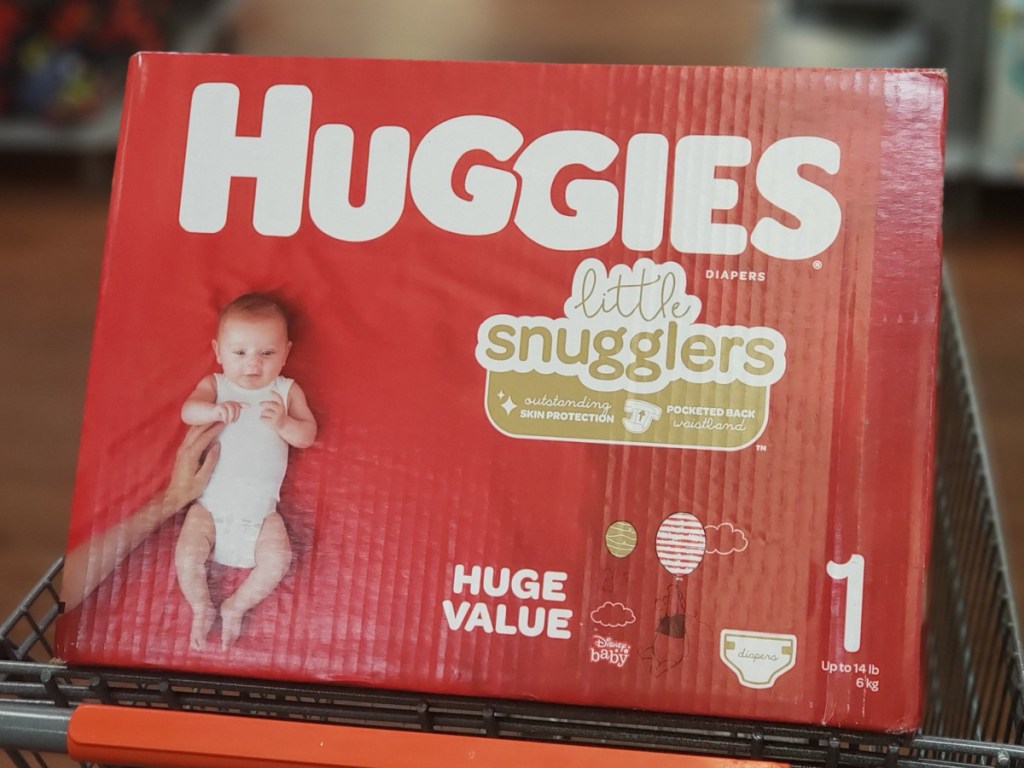 large huggies diaper box sitting in a walmart shopping cart