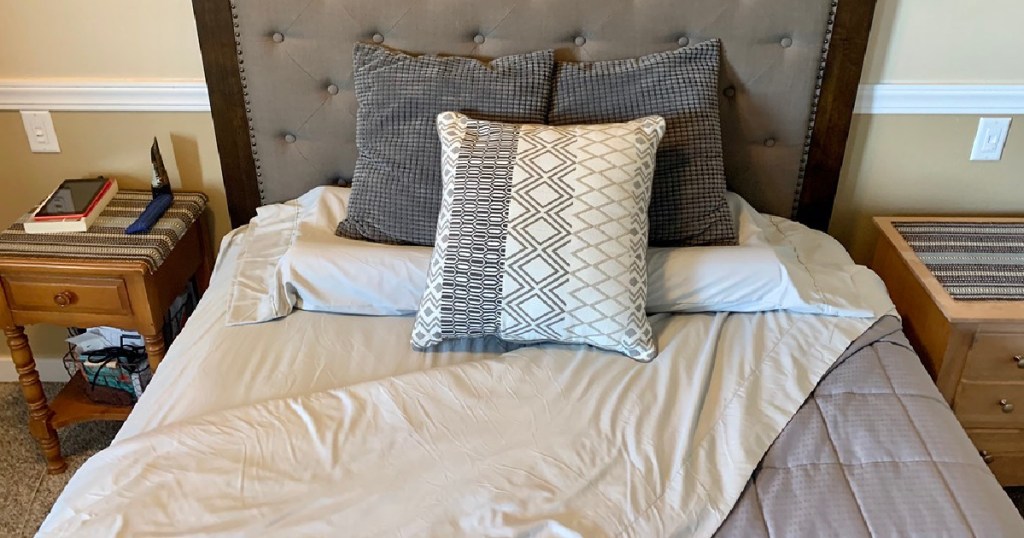 light gray sheets and pillows on bed