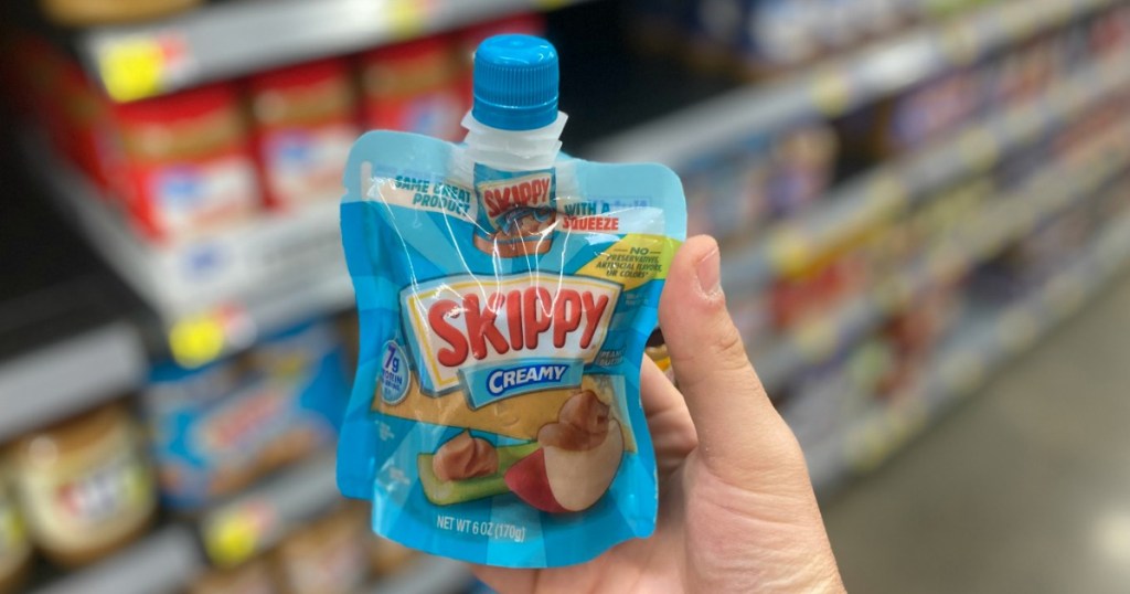 hand holding a Skippy Creamy Pouch