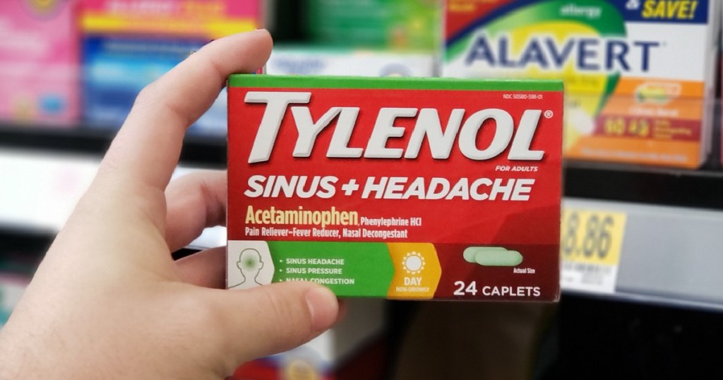 hand holding box of sinus medicine in store