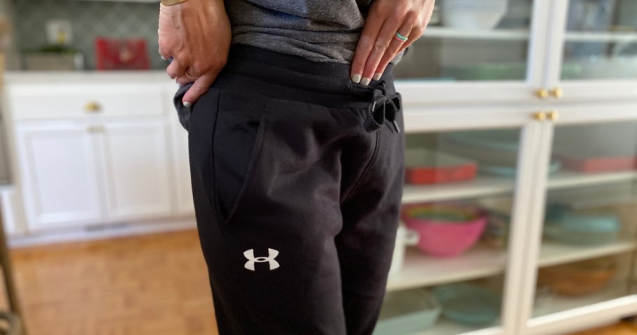 person wearing black under armour pants 