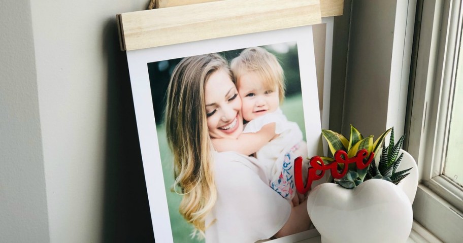 Walgreens hanger board print featuring a woman and toddler girl