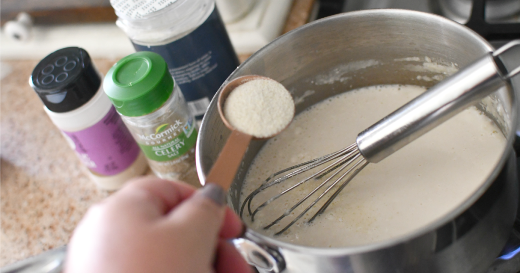 adding spices to a saucepan